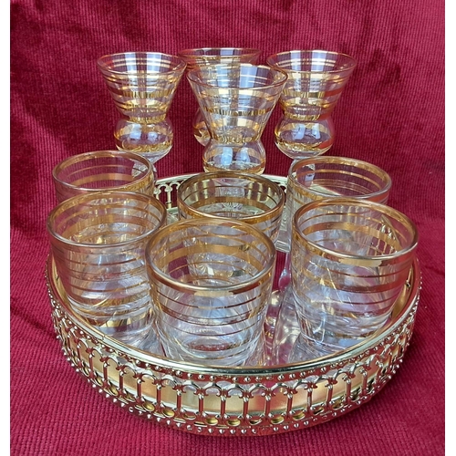 28 - A collection of vintage cocktail / shoot glasses and a mirror butlers tray.