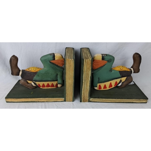 30 - A pair of wooden bookends in the form of clowns.