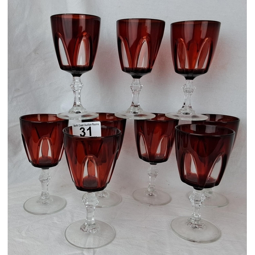 31 - A set of 9 Gothic Luminarc Durand ruby red stemmed glasses.