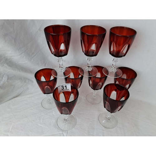 31 - A set of 9 Gothic Luminarc Durand ruby red stemmed glasses.