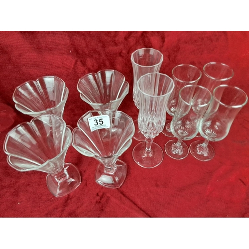 35 - A large assortment of vintage glassware.