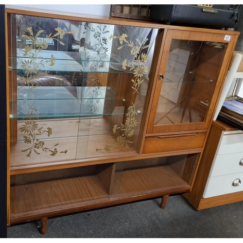 47 - A vintage/ Mid-Century display cabinet. Measuring 122 L x 30 W x 118 H