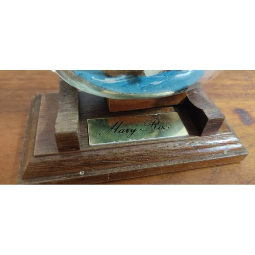 26 - A vintage ship in a bottle of the Mary Rose on wooden stand. Measuring approx 14cm in length.