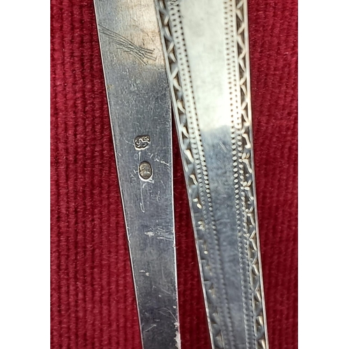 69 - A pair of early Georgian Sterling Silver bright cut tongs, made by John LeJevne, London circa. 1780.... 