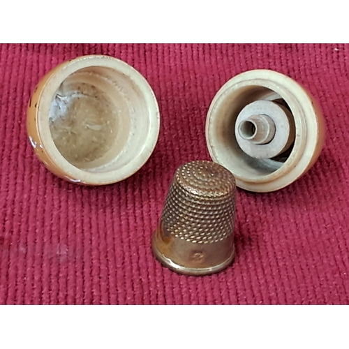 77 - A stunning antique bone thimble case and brass thimble.