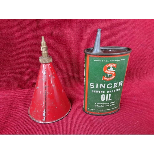 86 - Three vintage oil cans to include Singer Sewing Machine oil and more.