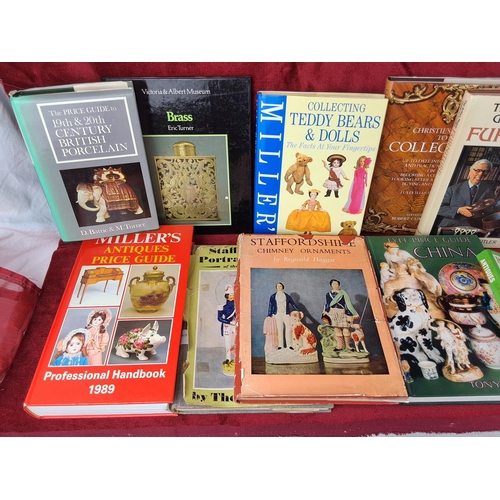 107 - An assortment of antique reference books.