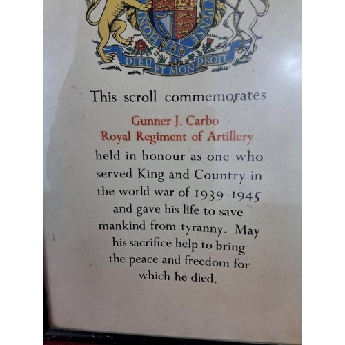 118 - A framed scroll to commemorate Gunner J. Carbo Royal Regiment of Artillery (measuring 34cm x 23cm) a... 