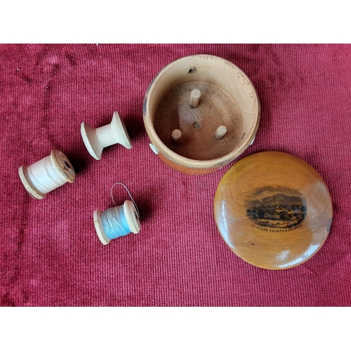 124 - An antique Mauchline Ware spool holder, 'St Marys church and Elleray, and three small spools.