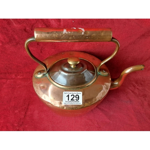 129 - A Victorian copper dove tailed kettle.