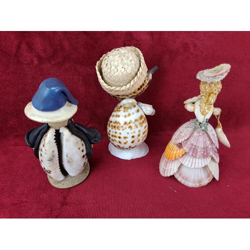 138 - A trio of figures made out of sea shells. Tallest measuring approx 16cm.