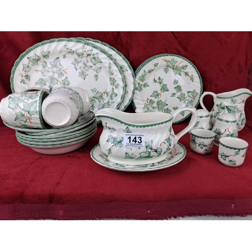 143 - A vintage tea set, to include cups, milk jug, plates and more.