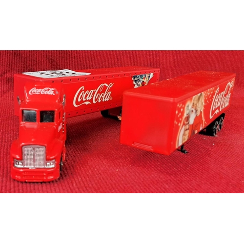 153 - Two Coca Cola model Christmas trucks.