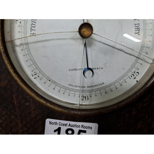 185 - An antique wood cased barometer, measuring 23cm wide.