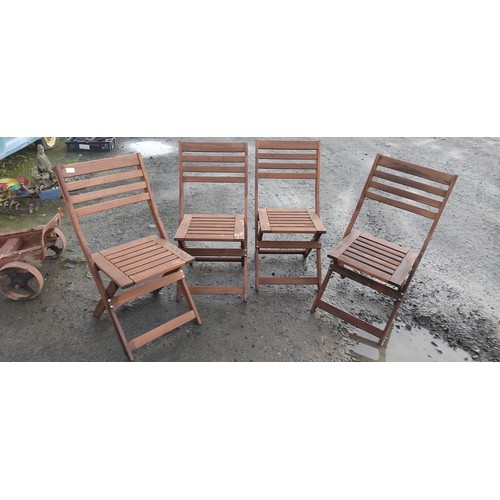 472 - A set of four folding garden chairs.