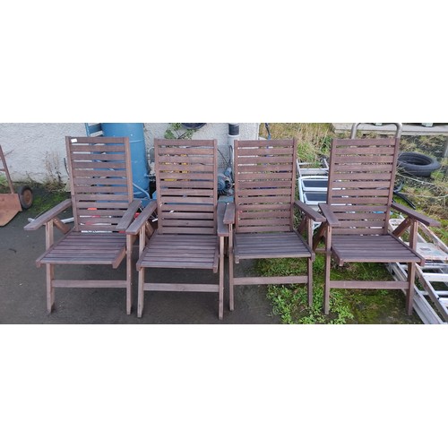 474 - A set of four folding deck chairs.