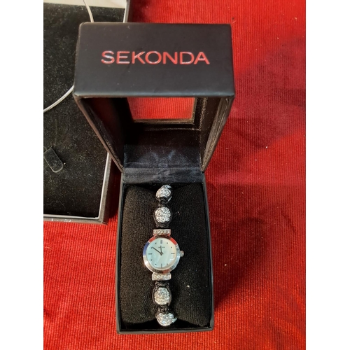 53 - A stunning boxed Belleek necklace and ceramic pendant, a boxed Sekonda ladies watch and a pair of ea... 