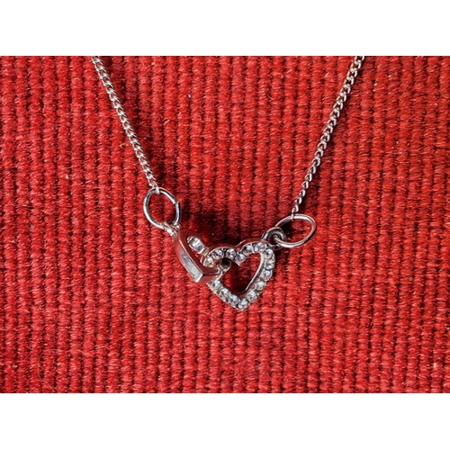 56 - A heart shaped necklace.