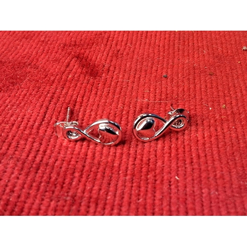 68 - A pair of Argento Sterling silver earrings and another.