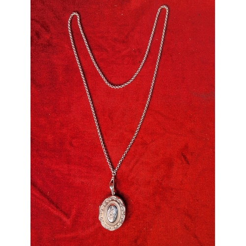 76 - A stunning sterling silver locket and chain. weighing 63.7 grams.