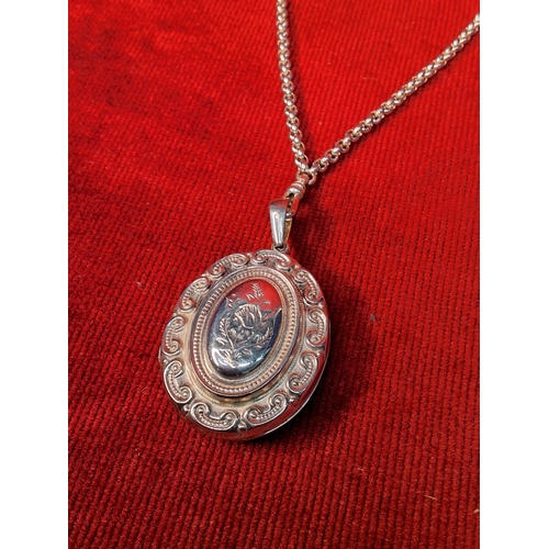 76 - A stunning sterling silver locket and chain. weighing 63.7 grams.