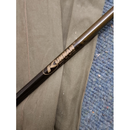 A Kunnan two piece fly rod and cloth bag, model 821100.