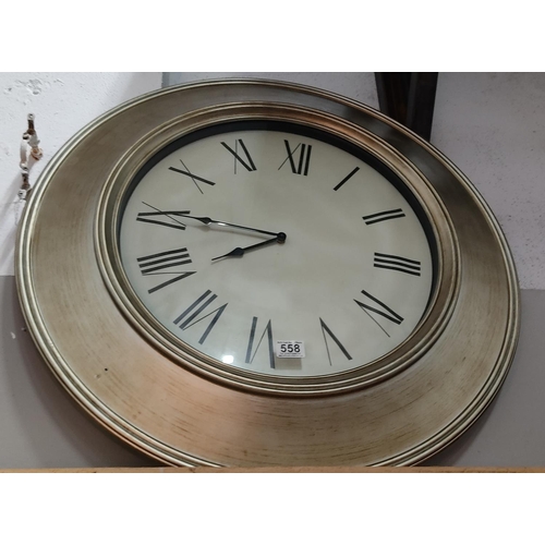 A large modern wall clock. approx 75cm in diameter.