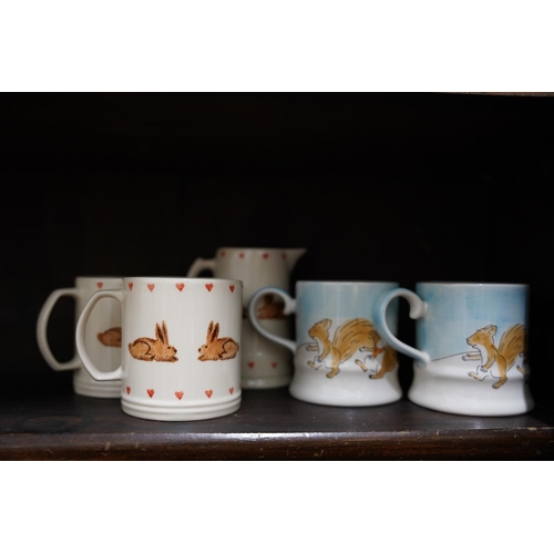 661 - Two mugs and jug hand painted with rabbits by Jane and Stephen Baughan, and two Christmas mugs Whitt... 