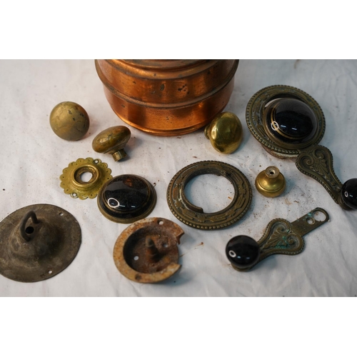 664 - A vintage copper lacquered pot, an antique cast iron black and gold porcelain window winder and more... 