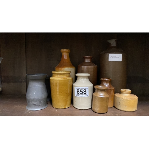 658 - A collection of antique stoneware bottles and two pewter tankards.