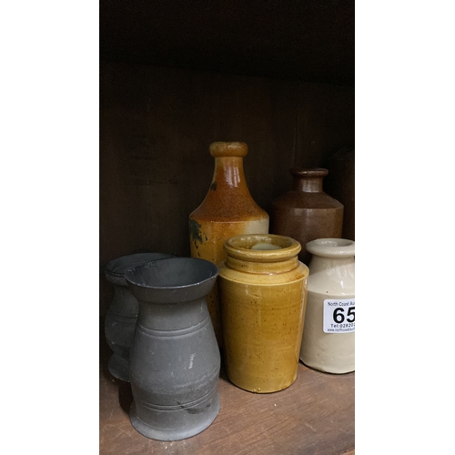 658 - A collection of antique stoneware bottles and two pewter tankards.