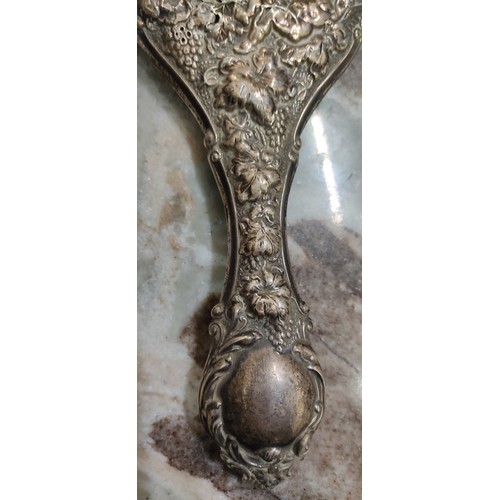 47 - An antique silver plated hand mirror. Measuring 26cm.