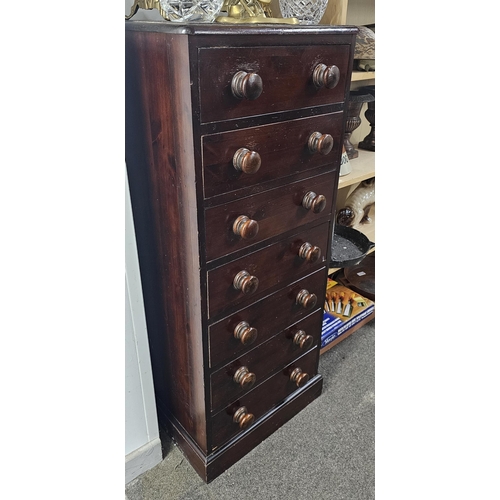 1 - An antique wooden chest of 7 drawers, measuring 15