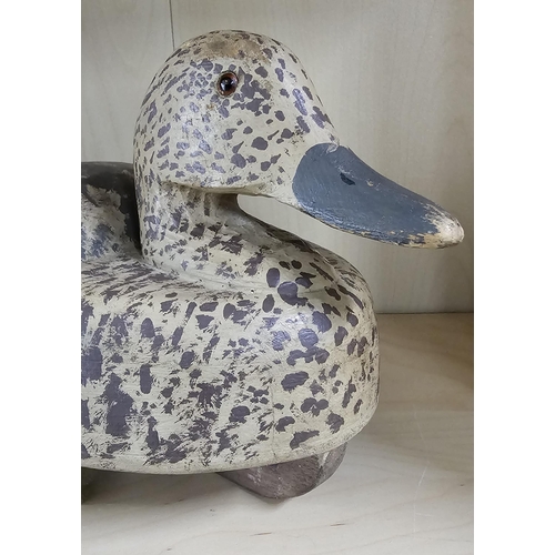 10 - A stunning handmade wooden duck decoy, with hand painted effect, measuring 39cm long.