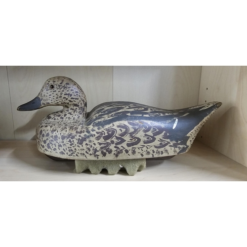 10 - A stunning handmade wooden duck decoy, with hand painted effect, measuring 39cm long.