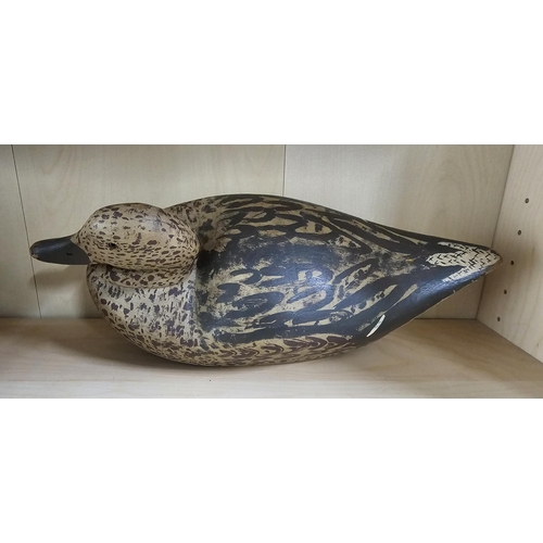 10 - A stunning handmade wooden duck decoy, with hand painted effect, measuring 39cm long.