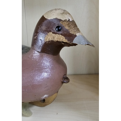 12 - A stunning handmade wooden duck decoy, with hand painted effect & damaged beak, measuring 33cm long.