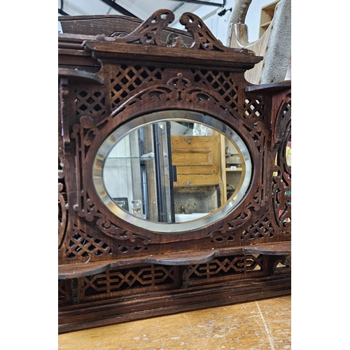 32 - A stunning & unusual antique apprentice piece over mantle mirror, measuring 33cm x 36cm.