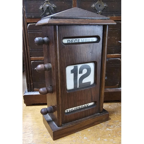 34 - An antique wood cased Perpetual calendar.