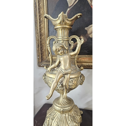 5 - A stunning set of large vintage brass candlesticks, with cherub design, each measuring 40cm tall.