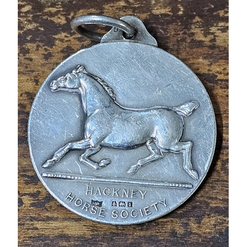 57 - A stunning antique Sterling Silver 'Hackney Horse Society' medal, produced by Mappin & Webb, fully h... 