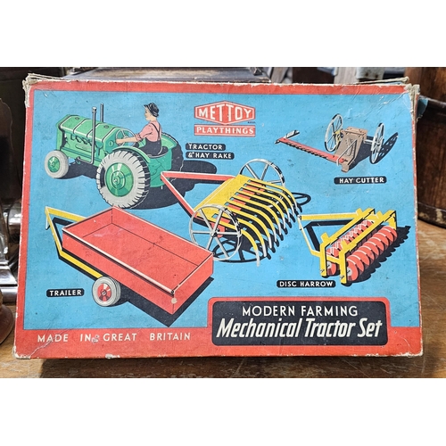 63 - A stunning antique Mettoy Playthings 'Modern Farming Mechanical Tractor Set', in original card box.