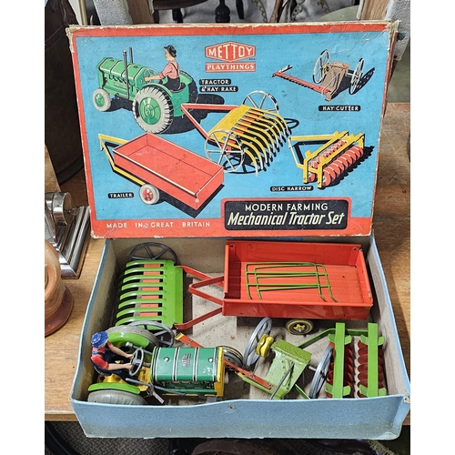 63 - A stunning antique Mettoy Playthings 'Modern Farming Mechanical Tractor Set', in original card box.