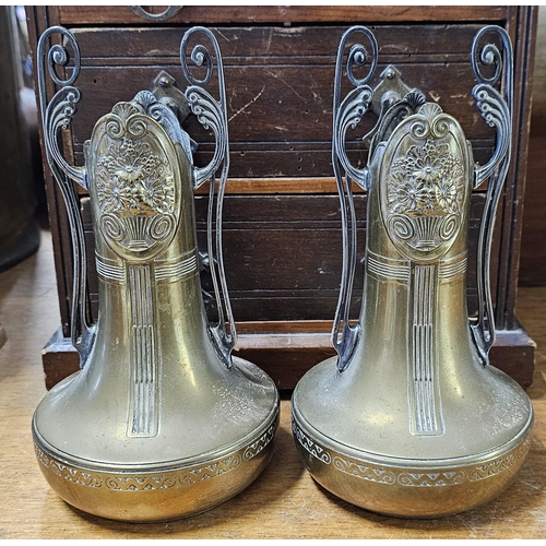 67 - A pair of antique Art Nouveau brass vases, measuring 21cm.