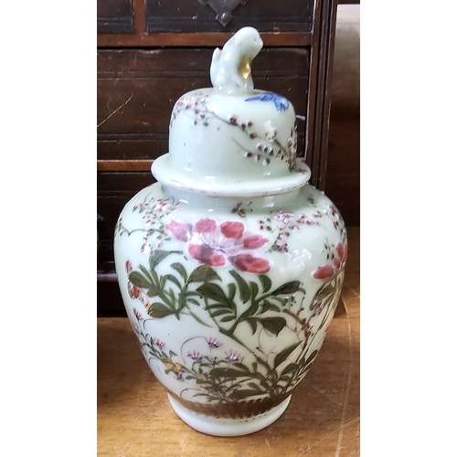 75 - A stunning pair of antique Chinese ginger jars with hand painted floral designs, measuring 22cm.