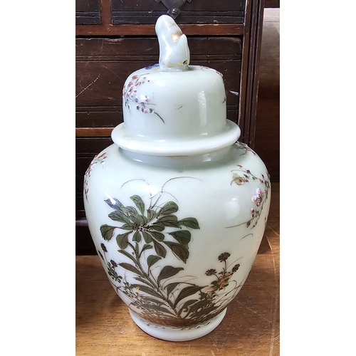 75 - A stunning pair of antique Chinese ginger jars with hand painted floral designs, measuring 22cm.