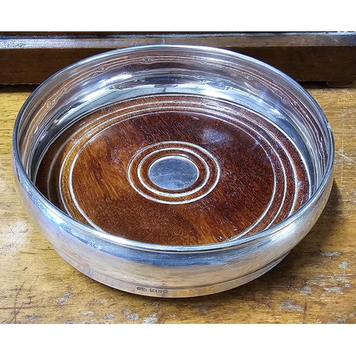 79 - A stunning antique Sterling Silver bottle coaster, 14cm diameter.