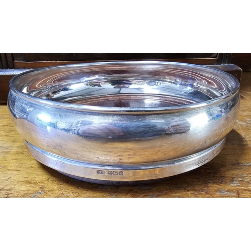 79 - A stunning antique Sterling Silver bottle coaster, 14cm diameter.