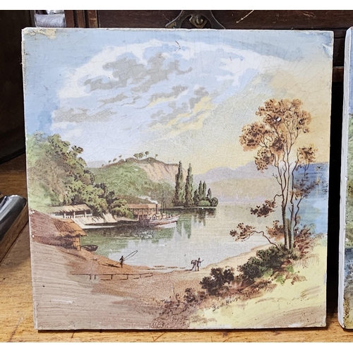 83 - A pair of decorative tiles showing decorative Country scenes.