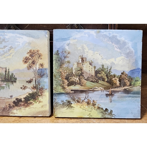 83 - A pair of decorative tiles showing decorative Country scenes.